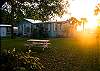 This is a view of the back yard and cottage facing the marsh. We have sunsets daily that will take your breath away!
