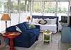 The living room features a very comfortable sofa, 1 twin day bed ( ideal for sleeping) and the TV with Cable and DVD player
