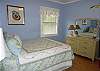 The pale blue bedroom is so cool and relaxing.  The photograhers in the room are from scenes of Tybee