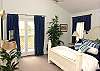 The master bedroom also has a small balcony to enjoy the fresh ocean air!