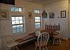 The dining table has both chairs and a built in wooden bench. Seating for 6 people plus additional seating at the kitchen counter.