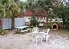 The back yard is exclusive for the Good Times Vacation apartment. There is a picnic table, dog house, play house, grill, patio and outside private shower with hot and cold water.
