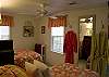 This bright and cheerful bedroom features one twin bed and one queen bed.
