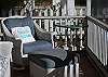We added folk art and a new lamp to better enjoy this screened porch.