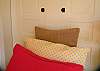 Both beds in Lemonade Mermaid have headboards made from vintage shutters. This is the twin bed.