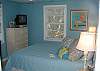 The 3rd bedroom with a queen bed and flat screen TV/ dvd player