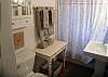The first floor has a full bathroom with a tub shower combination. We love the pedistal sink and beautiful towels.  The shower curtain is Shabby Chic!