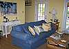 The living room is on the 1st floor, working fireplace and large screen TV with DVD.