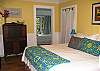 The king bedroom leads to the back 3rd bedroom as well as the 1st full bathroom.