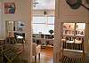 This door looks towards the third bedroom which has a twin bed and the library.