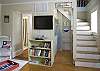 Our cottage offers another living room downstairs. Perfect for two families or large families with children. A place for everyone to enjoy a late night movie. Has the clubhouse feel. The laudry room is also downstairs along with a flat screen tv.