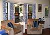 The front door is to the right and goes right out to the screened porch.