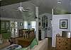 The front room is actually a combination of the living room, dining room ( seats 6) and open kitchen. There is also a bar with counter seating. Very open, airy and charming.  This room also leads to the front screened porch.