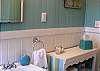 The cottage features two full baths as well as an outdoor shower with hot and cold water.