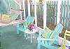 Views of the screened porch on rear of cottage.  Fun, bright and colorful!