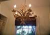 The master bathroom ( part of The Lettered Love master bedroom) features a rusty crusty vintage chandelier. We found this treasure on South Beach's  Lincoln Road Sunday flea market.