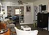 This is the view as you walk through the door!  The kitchen is to the right - see the doorway pass the flat screen it is fully equipped with everything you need - the dining area is ahead and to your right through the dining area is yet another great den!  Plenty of room for the family to be together - or spread out!