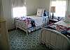 Sand and Sea bedroom has two twin beds. Both vintage bedroom frames.