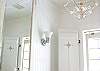 Even this bathroom has charm!  This is the bathroom on the main floor- chandelier and a vintage mirror. AND a claw footed bath tub!