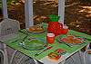 More porch seating - can seat a total of 8 guests at tables, and there is a wicker settee and a pair of rocking chairs.