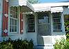 The entrance to the front screened/ glassed in porch.