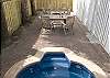 The entire downstairs is enclosed with a privacy fence.  The brick courtyard features outdoor seating, a fire pit and a Beautiful private spa, cool in the summer warm in the fall and winter. LED lighting provides spectacular night-time displays