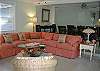 The living room has lots of comfy seating. This room is actualy one large room with the dining room and large open kitchen all in the same area. Full of mermaid decor!