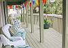 The front deck overlooks Butler Ave. Lots of outdoor seating and the bright nautical flags decorate the home!