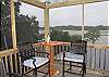 Our third floor screened porch has lots of seating and incredible views of the salt marsh!