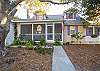 Welcome to Basking Under the Tybee Sun!  
The front porch has a wonderful view of the oaks and the bike riders who frequent 7th and 2nd Avenues.