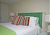 This is the other bedroom on the first floor. This bedroom has a king bed with cable TV.  The headboard is an old vintage shutter painted a GREAT green!