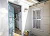 Door leading from kitchen area to back deck.