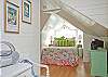 This is the view looking from the windwo seating area towards the queen bedroom area.