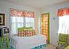 This picture of the master bedroom shows the twin bed located in there with the king and also the TV.