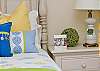 Details of second bedroom upstairs with queen bed.