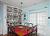 The cottage has a very open layout. This is the large family room with cable TV and library, dining room and even the kitchen. There is also a wood burning fireplace. Tall ceilings and lots of natural lighting.