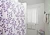 View of second bathroom. Each bathroom has a shower.
