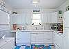 Bright, cheerful, beachy kitchen!  Entry to kitchen is through the courtyard/patio.