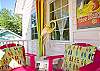 Bright, colorful screened porch awaits you at Barefoot Children!