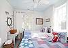 This nautical themed bedroom has three full size twin beds. Ideal for a family or for a girls' weekend. ( Book club anyone?)