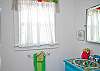 This is the full bath; this bathroom is located between the 2 bedrooms.