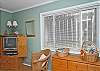 This bedroom has two twin beds as well as cable TV.