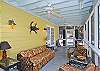The screened porch has lots of seating as well as a large farm style table and chairs to enjoy meals or playing games.