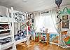 Downstairs bedroom #2.  Bunk beds on bottom; top of beds are for play; not a sleeping area.  Perfect pirate decor!