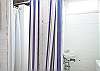 Downstairs enclosed area offers great outdoor showers; perfect for washing off that beach sand before heading indoors!