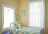 Twin bed located in bedroom #1.