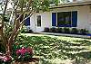 Front exterior of Barefoot Bliss Cottage. Beautiful, blooming crepe myrtle!