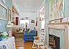 View into interior of Inlet Breeze cottage from front door.  Hallway leading to living room and kitchen/dining area.