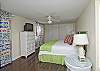 This is the other bedroom on the first floor. This bedroom has a king bed with cable TV.  The headboard is an old vintage shutter painted a GREAT green!