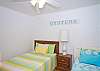 Bedroom #1 - one double and one twin bed to fit various sleeping needs.  Bright, beachy colors made this room a sunny getaway on it's own!